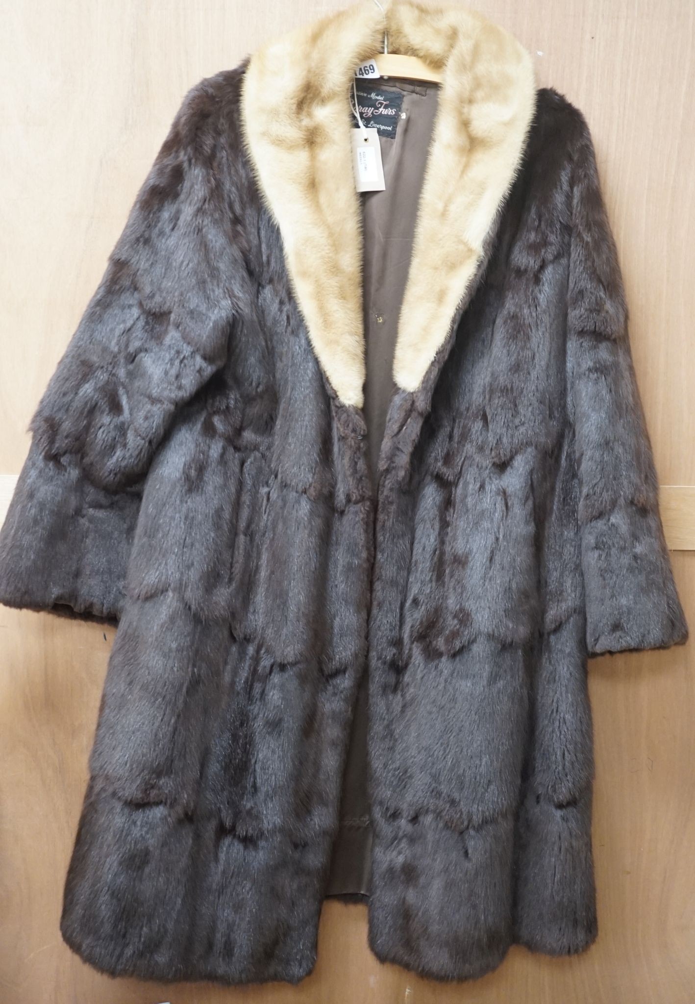 A ladies dark brown squirrel coat with blond mink collar by Baray Furs.